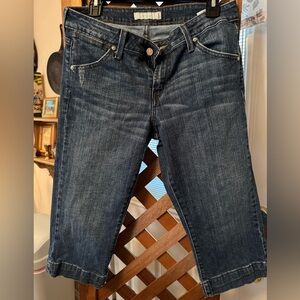 Levi's blue denim capri jeans with orange stitching and cream label